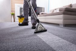 Low,Section,Of,A,Person,Cleaning,The,Carpet,With,Vacuum