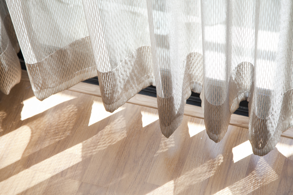Light,shine,through,the,curtain.,close,up,of,draperies,at